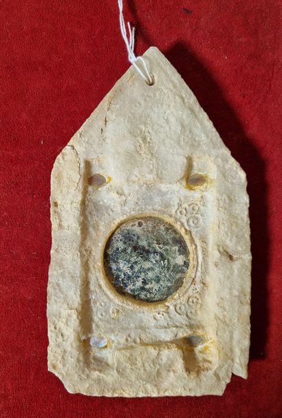 Mirror in the form of a stele decorated with...