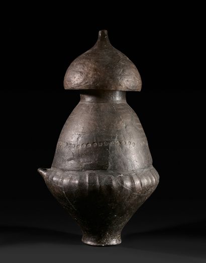 Large biconical cinerary urn decorated with...