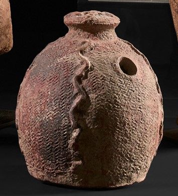 Terracotta flask decorated with snakes and...
