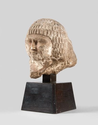 Head of a character from a statue leaning...