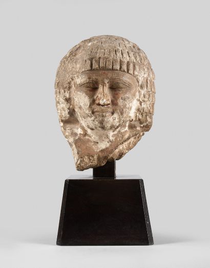 Head of a character from a statue leaning...