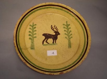 Plat Savoie en terre vernissée, orné d'un...