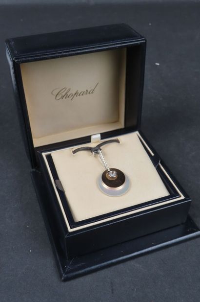 CHOPARD. Pendentif en or gris et rose (750/1000e),...