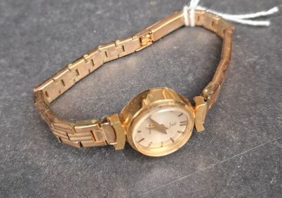 YEMA. Montre de dame, boîtier rond en or...