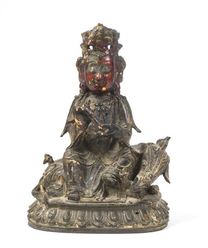 Bouddha assis sur un éléphant.
Bronze, traces...