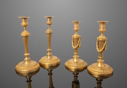 Deux paires de bougeoirs en bronze doré,...