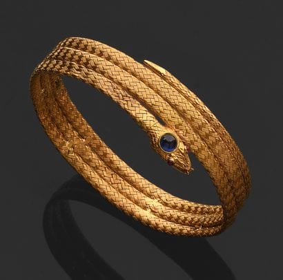 Bracelet en or 750‰ enroulé à trois rangs...