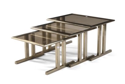 Suite of three nesting tables, brushed metal...