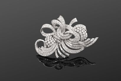 Grande broche de corsage rayonnante en platine...