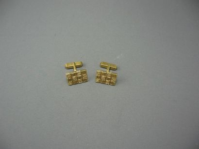 Boutons de Manchettes 
en or, stylisant un...