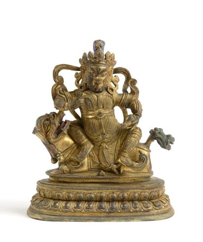 Bodhisattva sur un chien de fô, bronze doré....