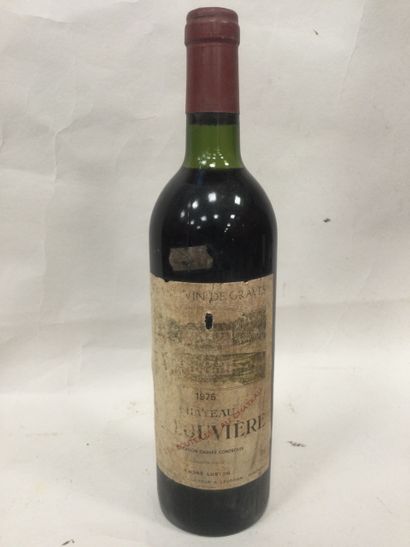 Une bouteille Château LA LOUVIERE 1975 (...
