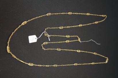 Long sautoir ancien en or jaune 18K (750/oo)...