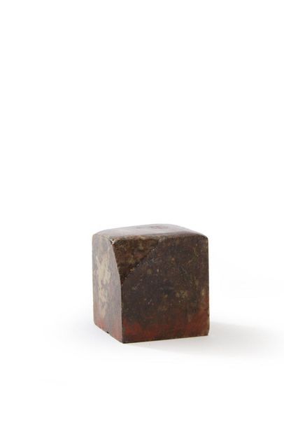 Square-shaped stamp made of brown soapstone...