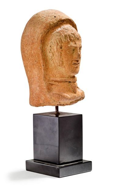 Male votive head in terracotta presented...