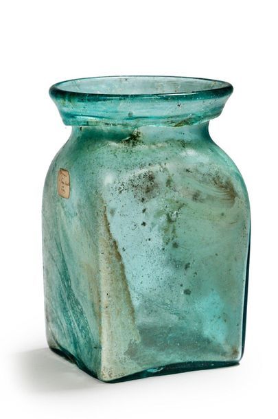 Funerary urn with prismatic belly, wide hemmed...
