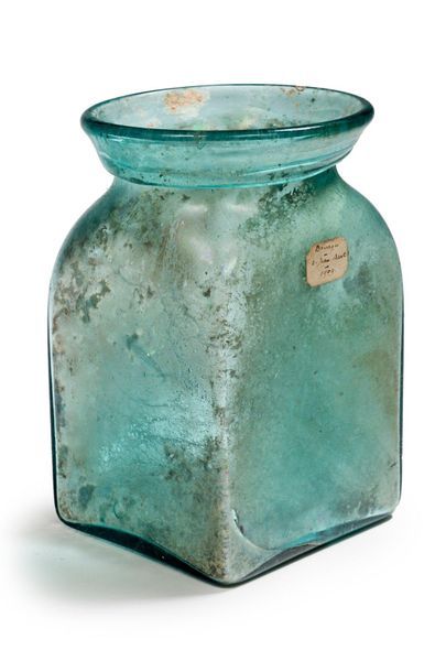 Funerary urn with prismatic belly, wide hemmed...