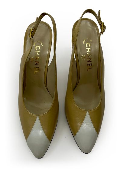 Chanel. Pair of beige and white leather pumps...