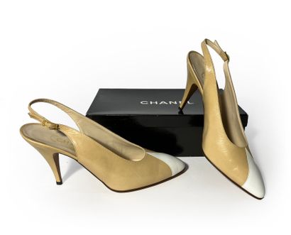 Chanel. Pair of beige and white leather pumps...