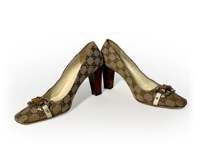 Gucci. Pair of leather and fabric pumps monogrammed...