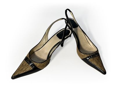 Christian Dior. Pair of navy blue leather...