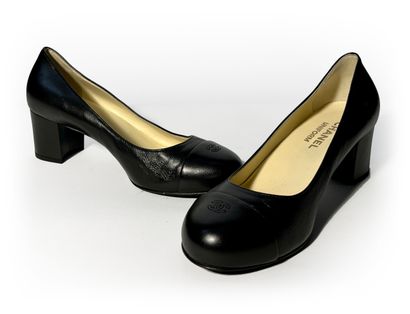Chanel. Pair of navy blue leather pumps....
