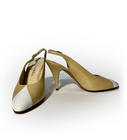 Chanel. Pair of beige and white leather pumps...