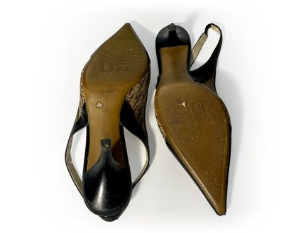 Christian Dior. Pair of navy blue leather...