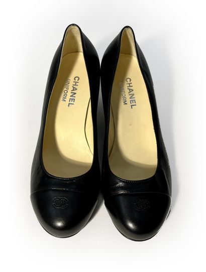 Chanel. Pair of navy blue leather pumps....