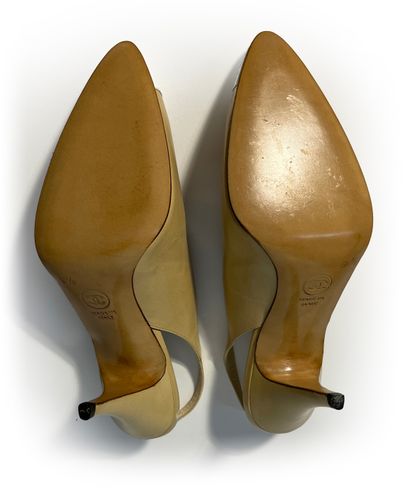Chanel. Pair of beige and white leather pumps...