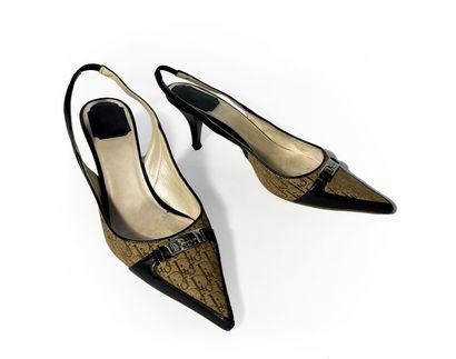 Christian Dior. Pair of navy blue leather...