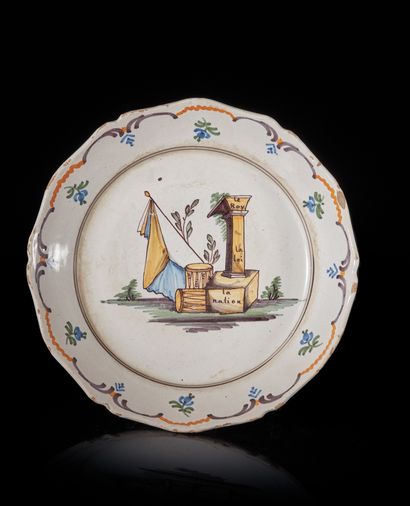 NEVERS
An earthenware plate of contoured...