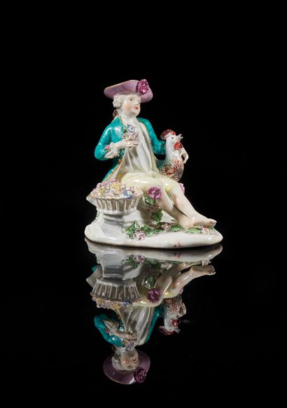 MEISSEN
Statuette of a young man, seated...
