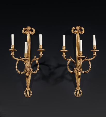 Pair of three-light ormolu sconces, decorated...