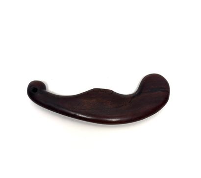 Carved wooden throwing club.
Maoris