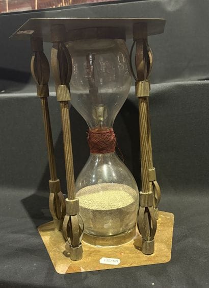 Hourglass with two glasses joined by cardboard...