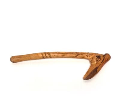 Bird's beak club in light wood carved with...