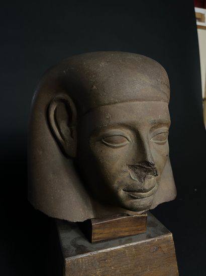 MAN'S HEAD
made of brown stone, on an antique...