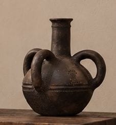 SPHERICAL RITUAL VASE 
with three handles,...