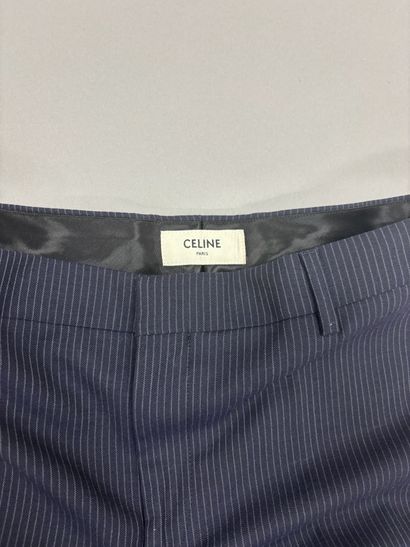 CELINE. 
Pantalon de tailleur bleu rayé....