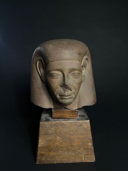MAN'S HEAD
made of brown stone, on an antique...