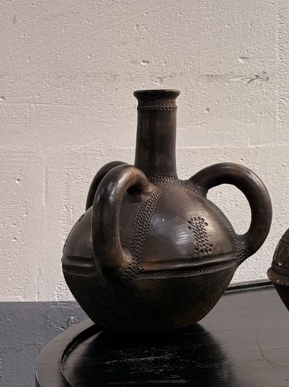 SPHERICAL RITUAL VASE 
with three handles,...
