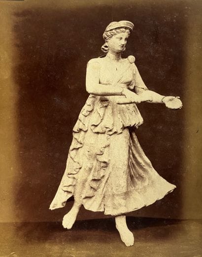 PHOTOGRAPH 
in sepia depicting a Tanagra....