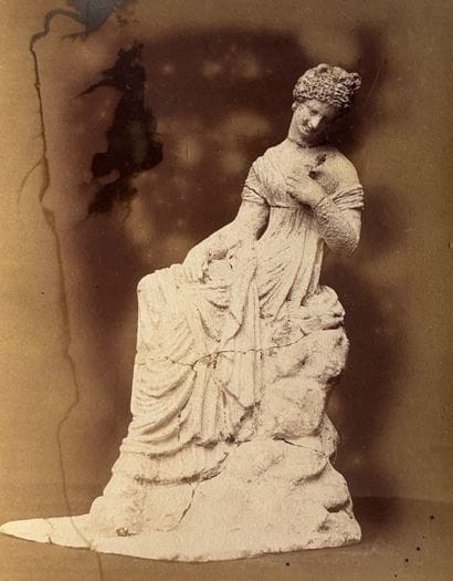 PHOTOGRAPH 
in sepia depicting a Tanagra....