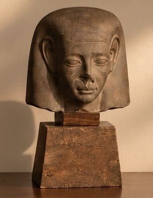 MAN'S HEAD
made of brown stone, on an antique...