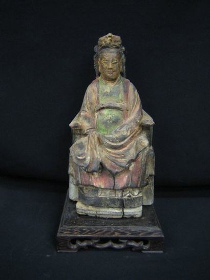 Matriarche assise sur un trône. En bois sculpté...