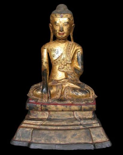 Bouddha assis sur un trône, exécutant le...