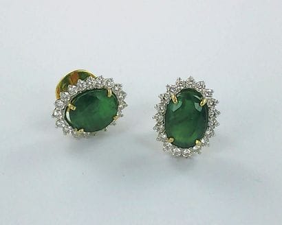 Pair of 750 two-tone gold earrings set with...