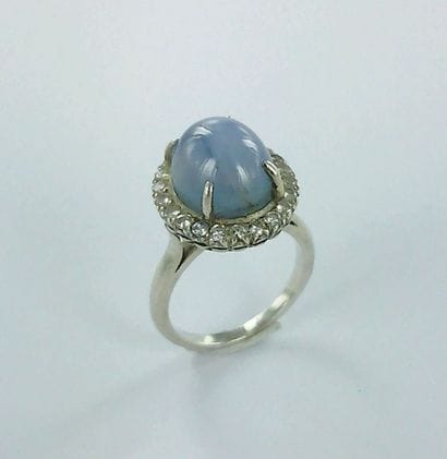 Silver ring set with a star-shaped cabochon...