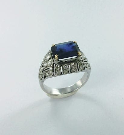 750-thousandths white gold ring set with...